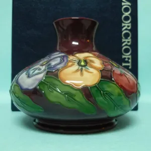 A Moorcroft Squat Vase (Dia 5.23") in the Pansy Design by Rachel Bishop