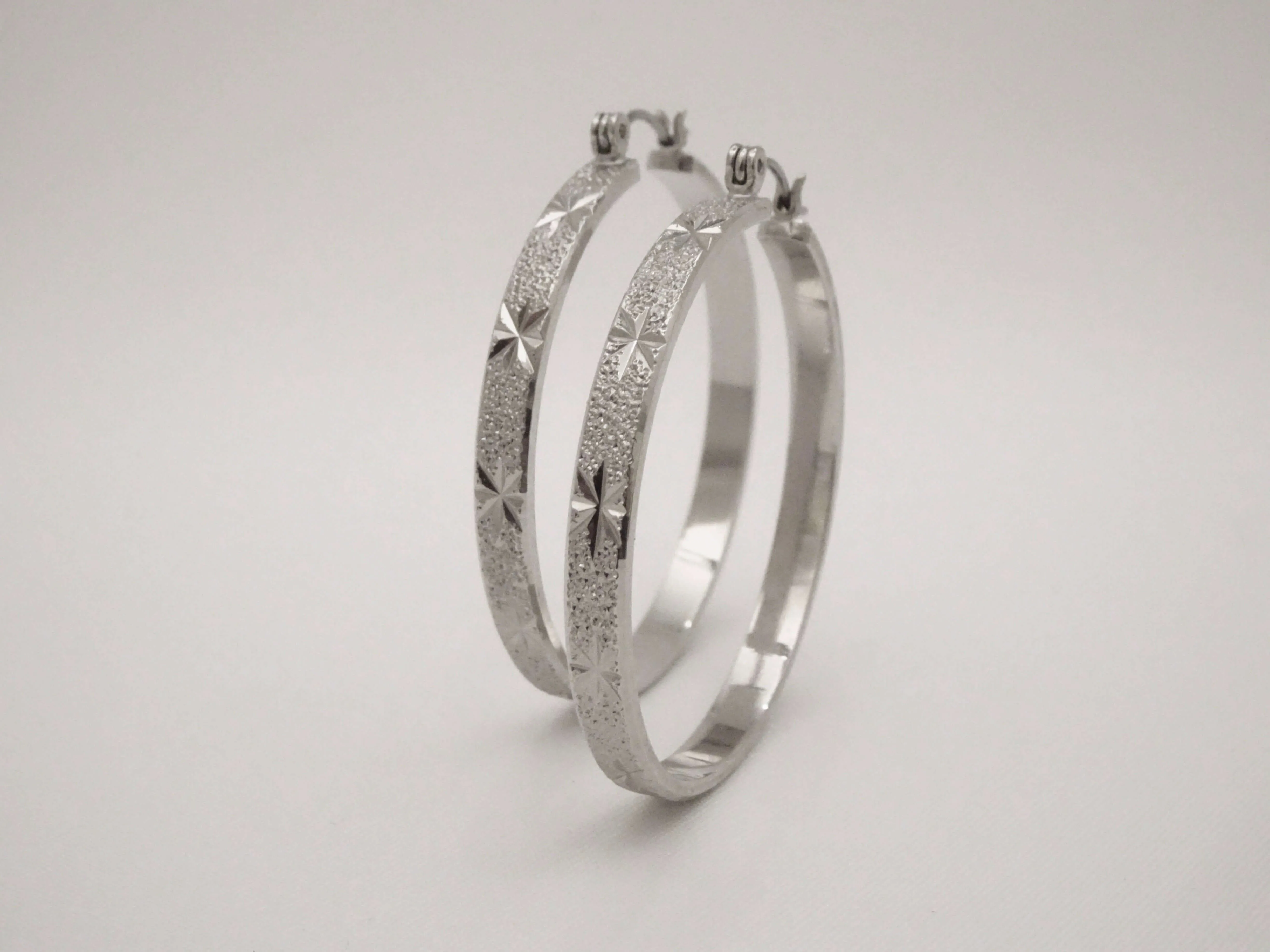 The Etched Starburst Hoop Earrings