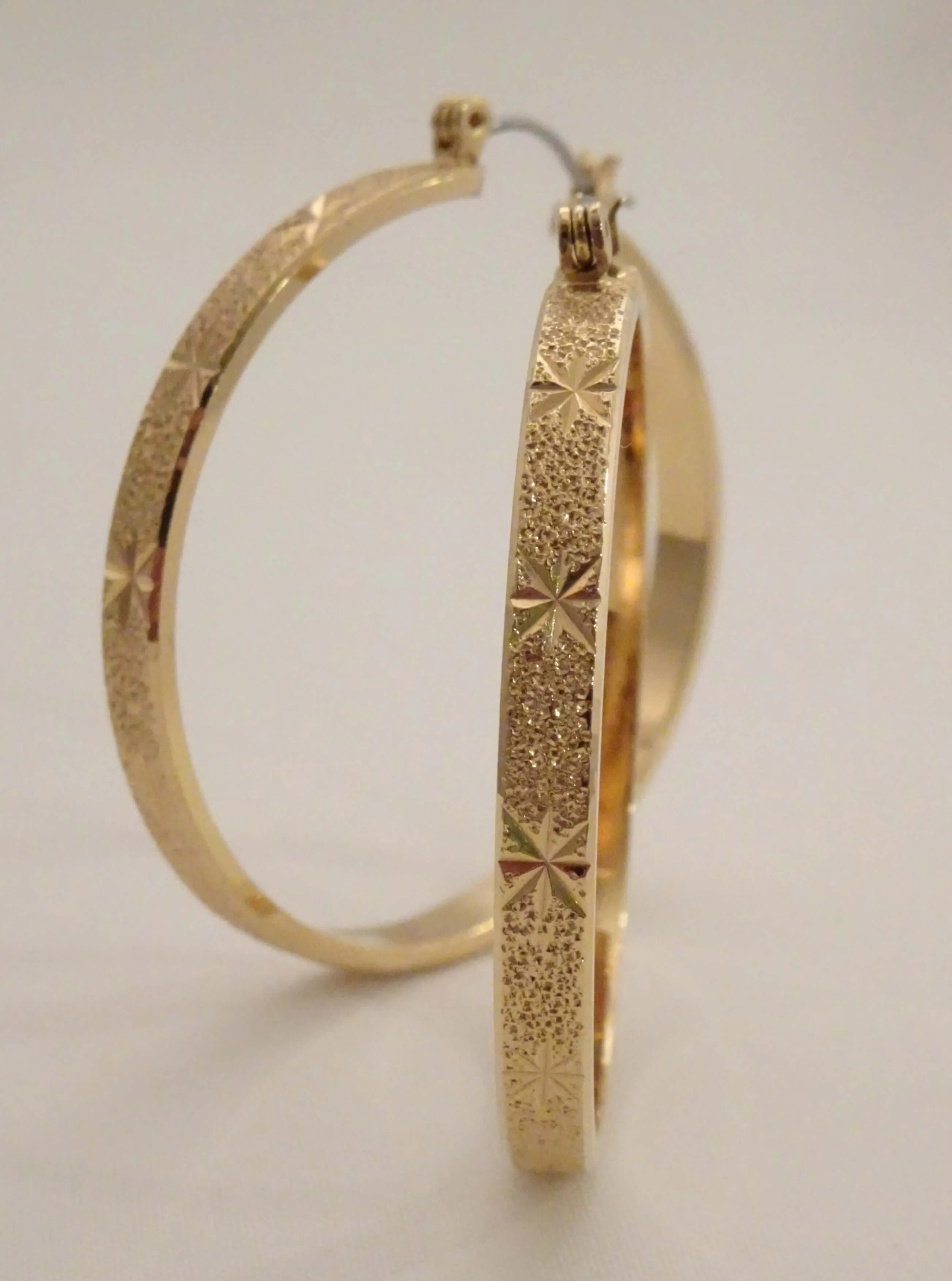 The Etched Starburst Hoop Earrings