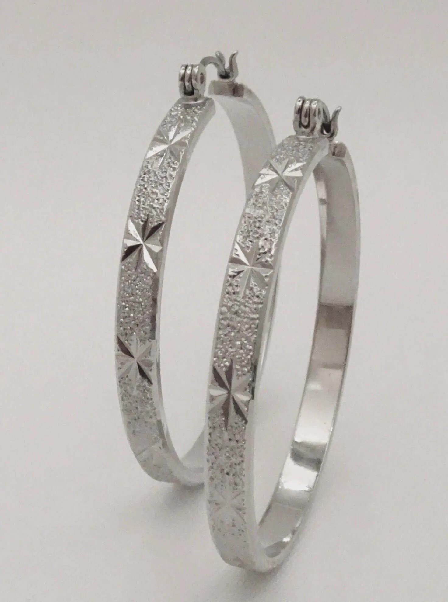 The Etched Starburst Hoop Earrings